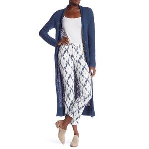 Free People "Indigo Skies" Crop Flare Jeans with frayed bottoms.